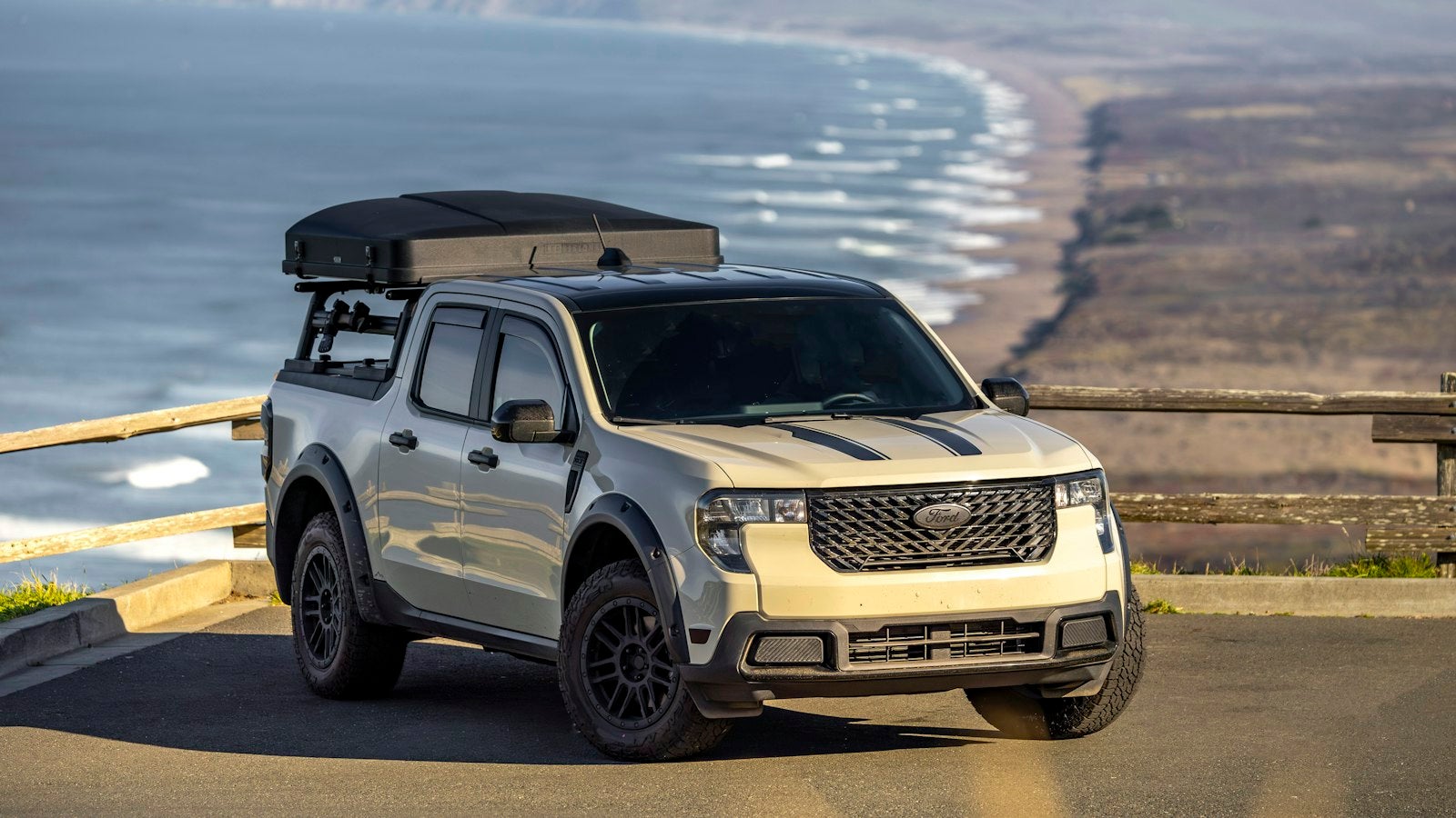 Ford Maverick pickup with rooftop tent at a coastal overlook